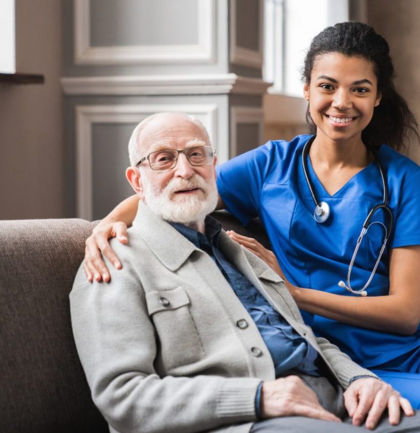 front-view-portrait-of-caring-afro-nurse-taking-care-of-an-elderly-caucasian-man-grandfather.jpg